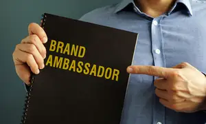 Person Holding Notebook Titles Brand Ambassador