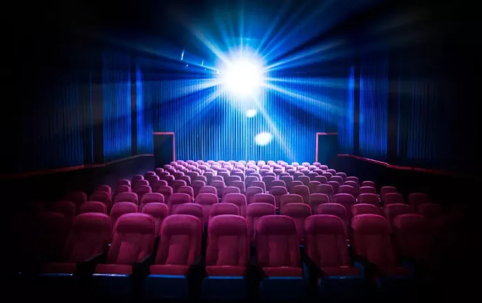 Movie Theater With Empty Seats And Projector